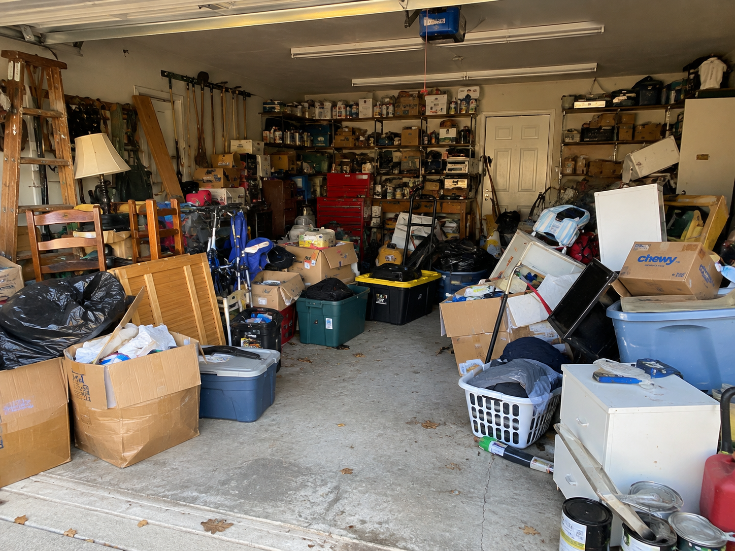 Cluttered garage before a junk removal cleanout